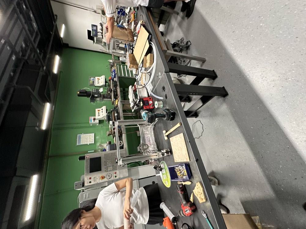 Assembly workbenches with people building prototypes